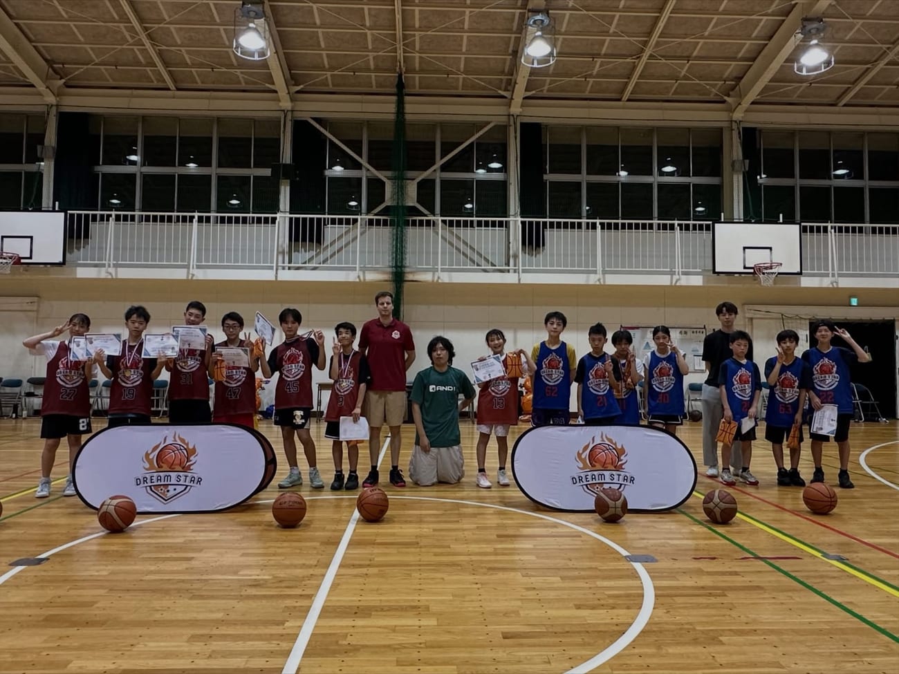 Dream Star U12 and U15 teams posing together after a tournament