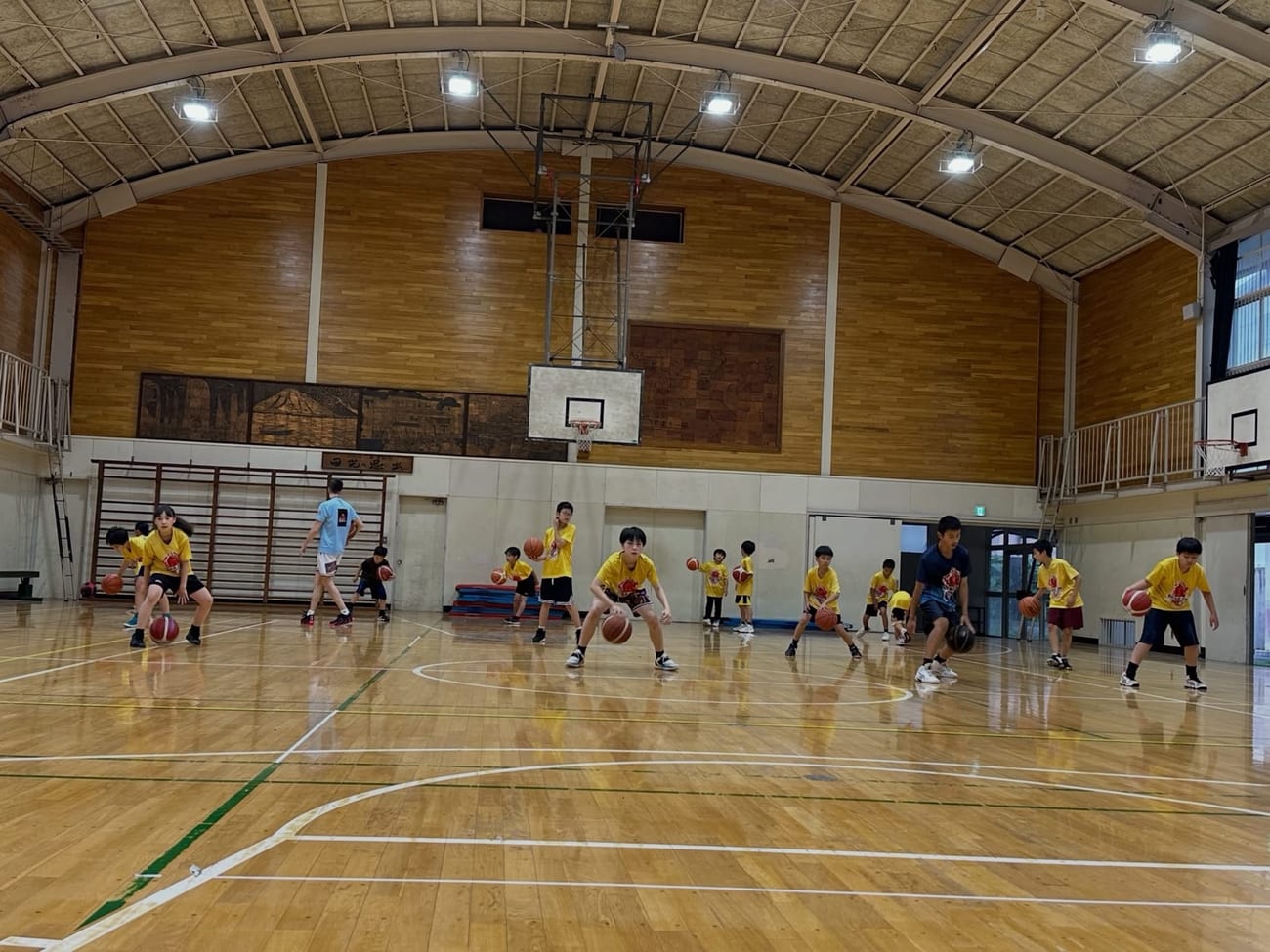 Young players practicing a dribbling drill during training