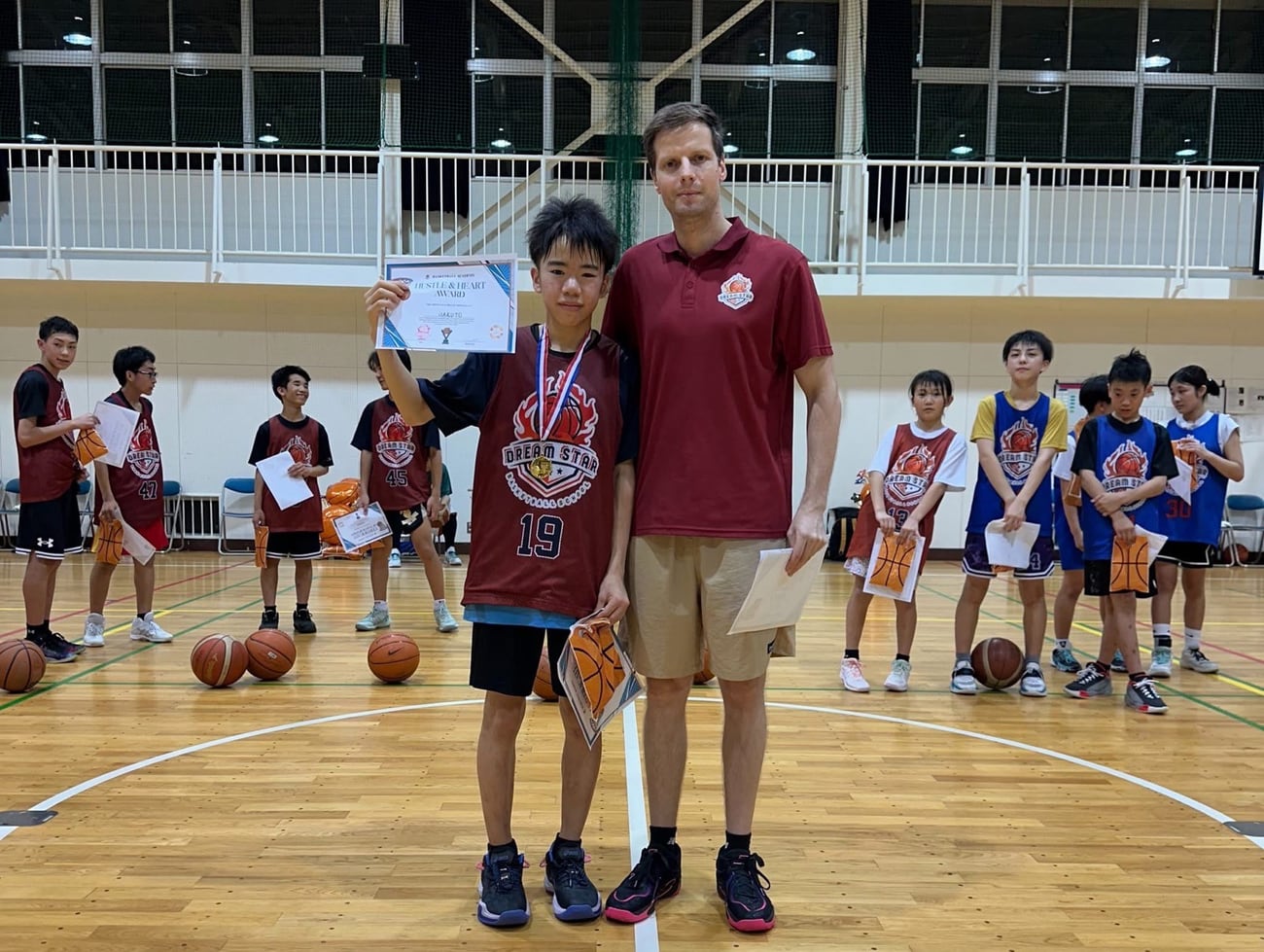 Coach Stefan Stankovic presenting a player with an award